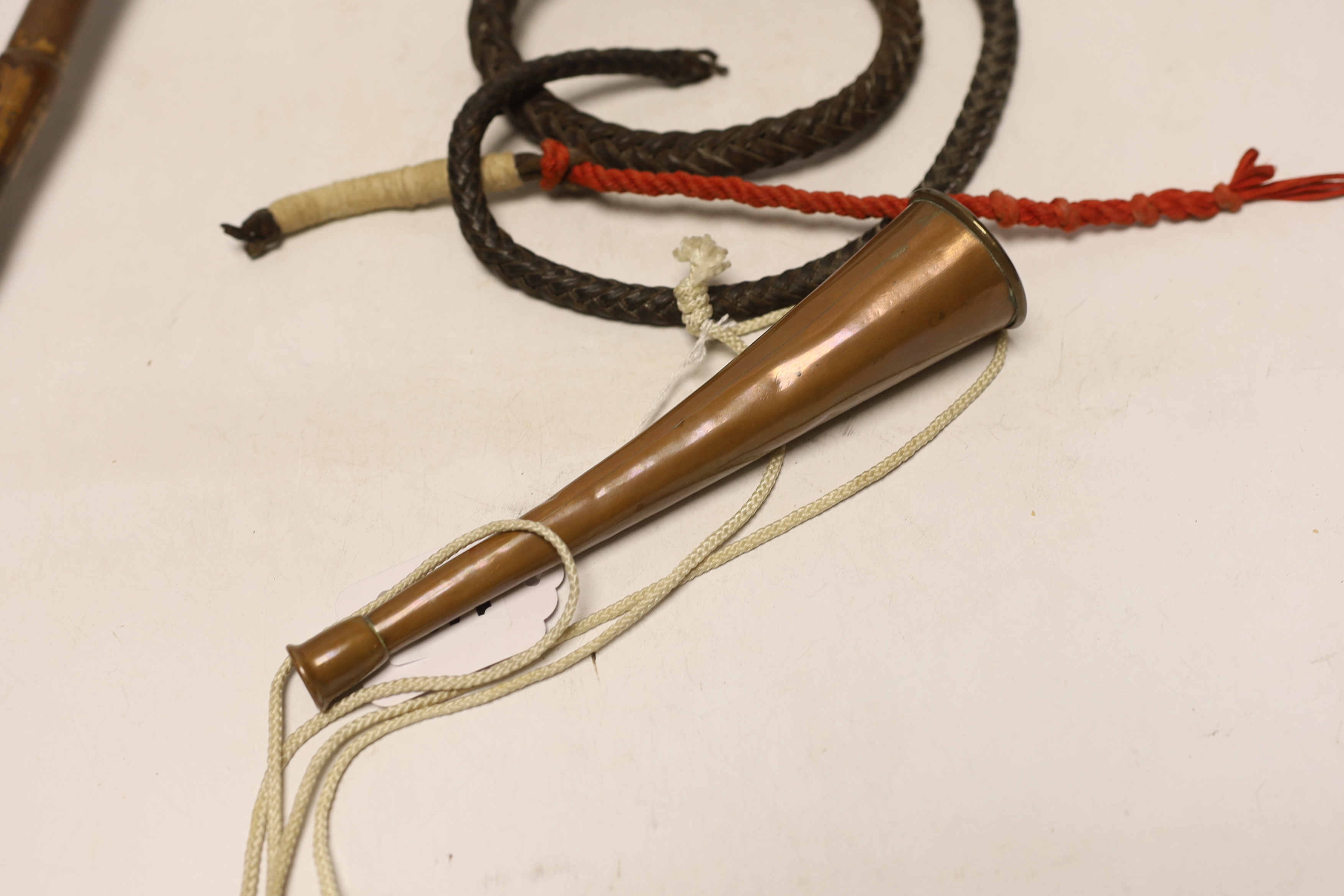 A silver mounted riding crop, a hunting horn and a horn whistle